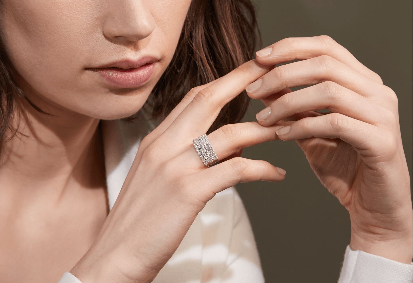 A woman wearing a diamond fashion ring