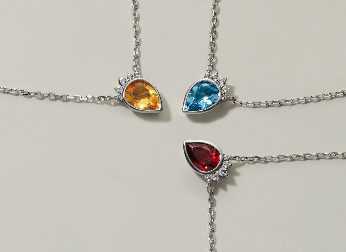 3 gemstone pendants of different colors
