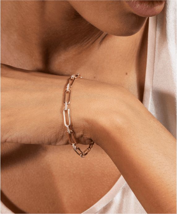 A woman wearing a paper clip fashion bracelet