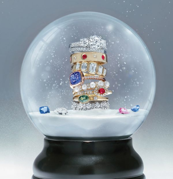 Mobile Image of a collection of holiday jewelry in a snowglobe