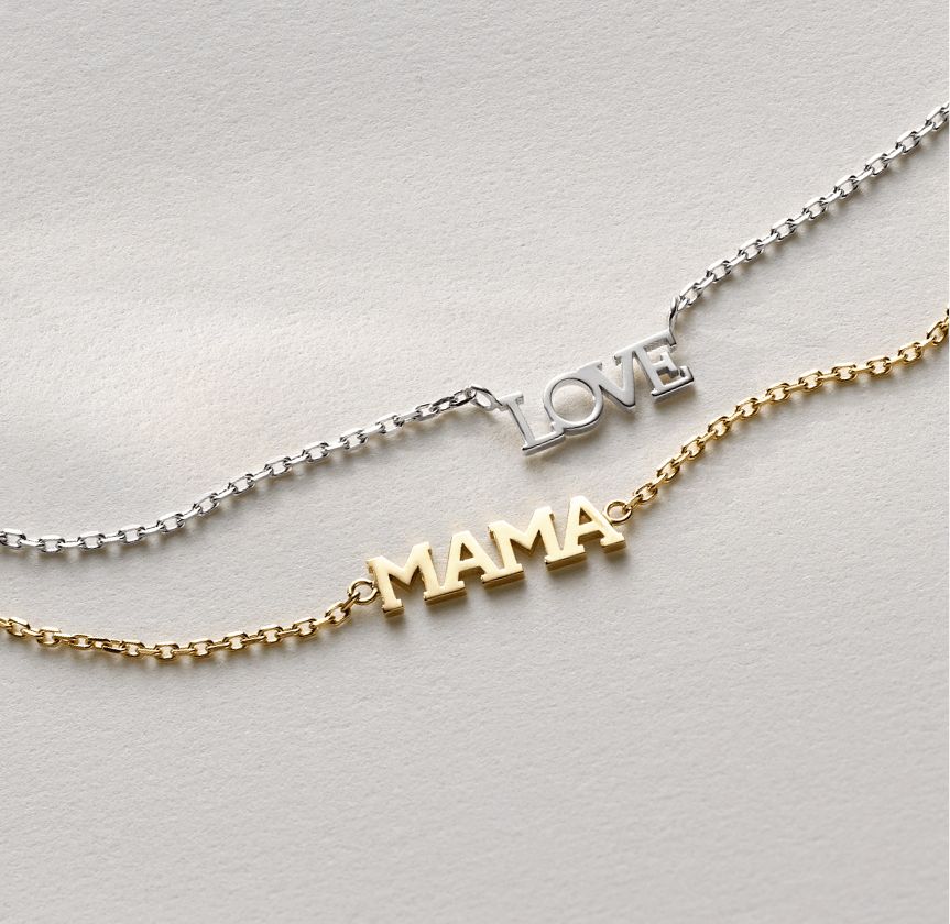 Two mother's day necklaces, one that says love and another that says mama