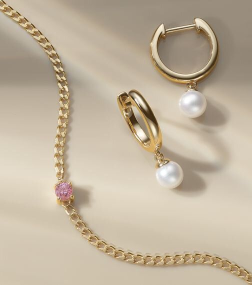 A pair of pearl fashion earrings and a diamond fashion necklace