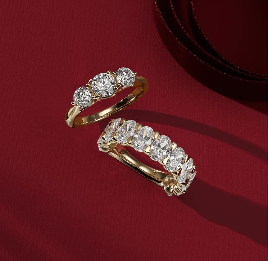 Two diamond anniversary bands on a red background