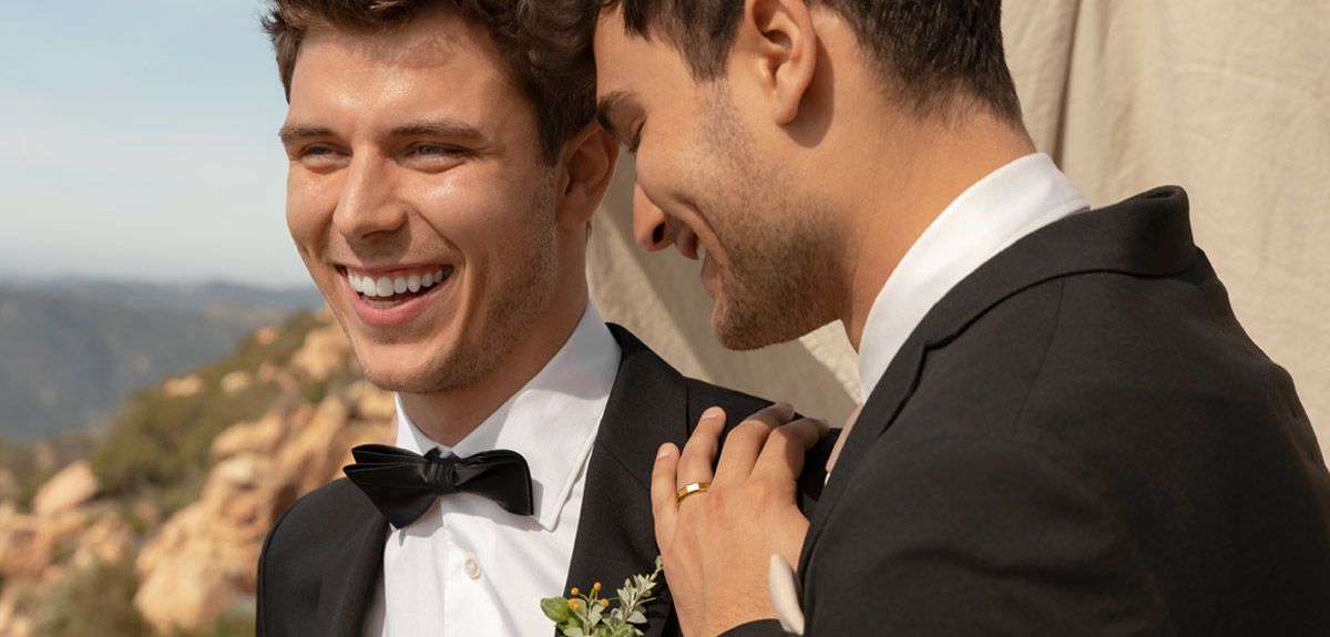 Two Grooms Smiling On Their Wedding Day