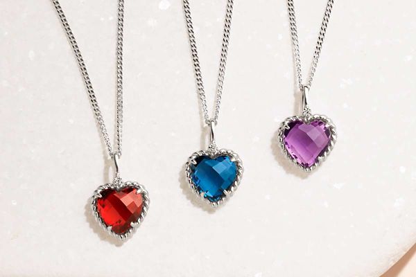 Mobile image of a collection of heart shaped gemstone pendants