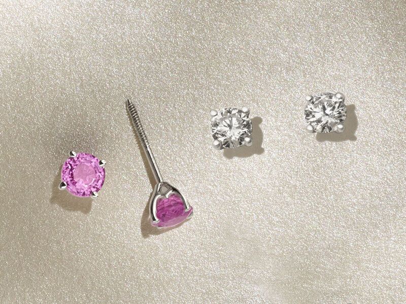 A pair of sapphire solitaire earrings