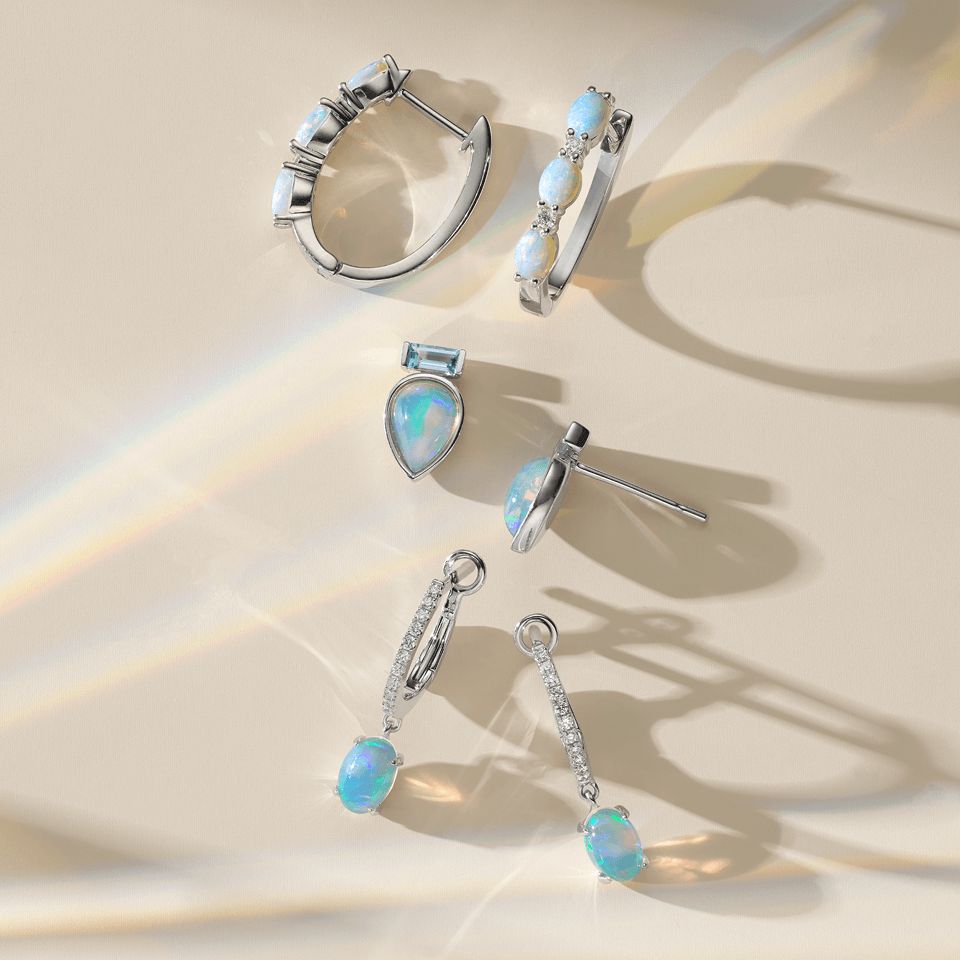 Three pairs of opal earrings of different styles