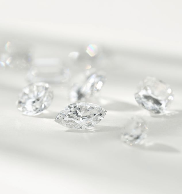 A collection of loose diamonds of various shapes.