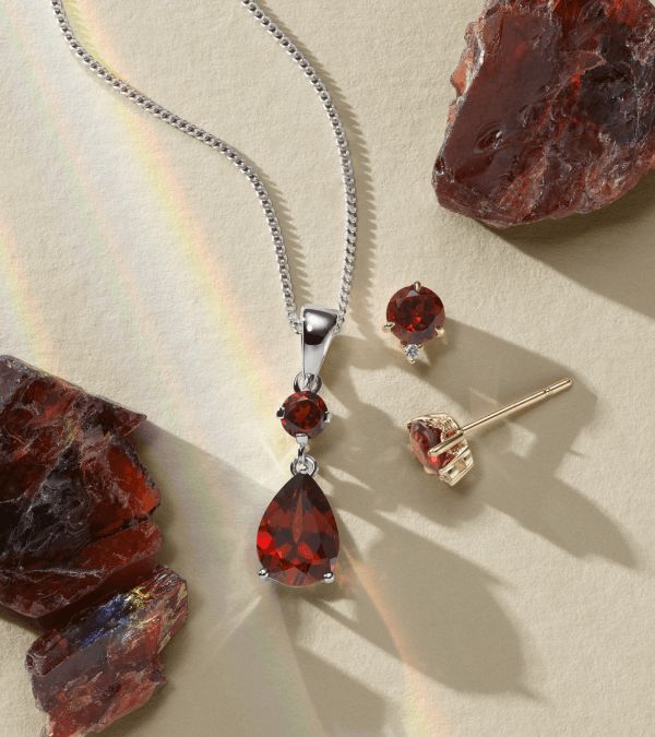 A collection of garnet birthstone jewelry for January