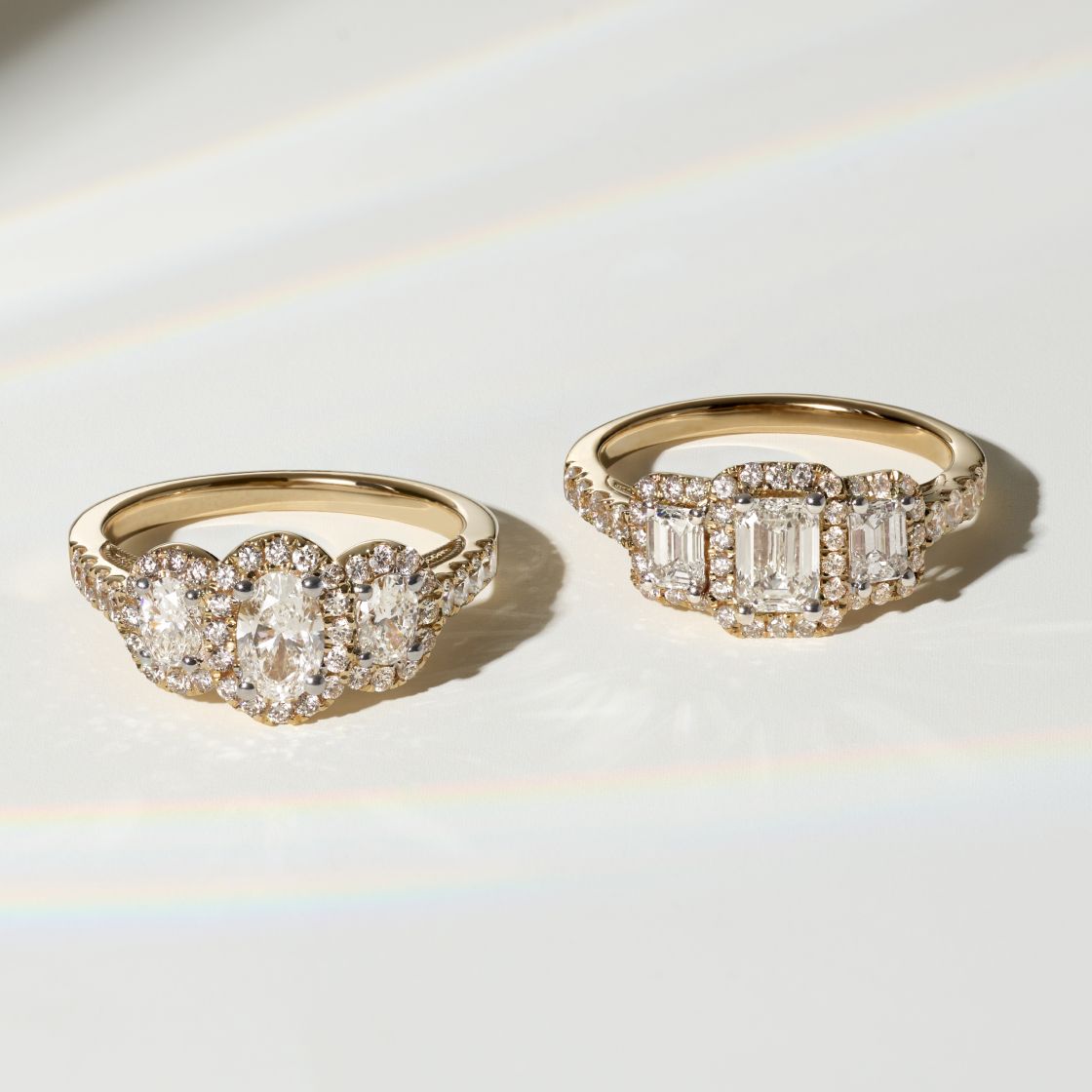 A woman wearing a 3 stone diamond engagement ring