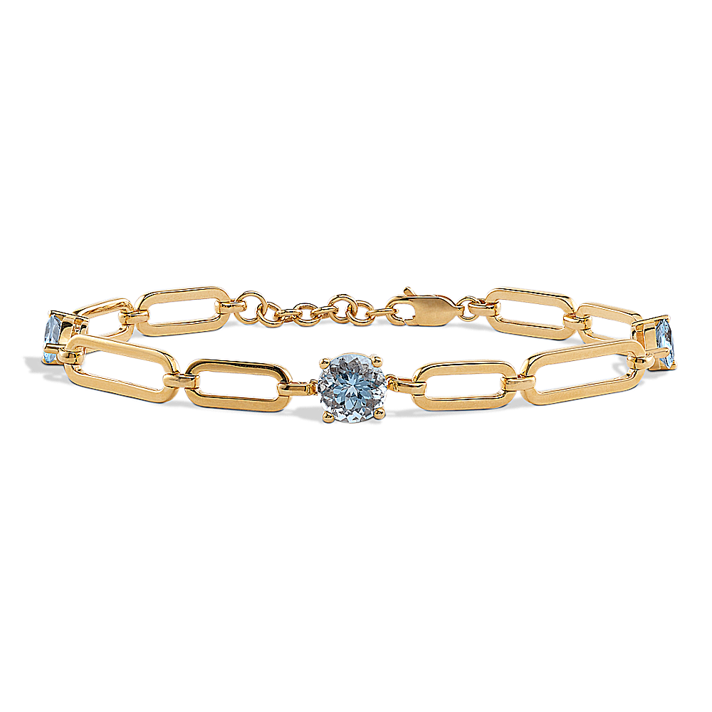 Blue topaz tennis on sale bracelet yellow gold