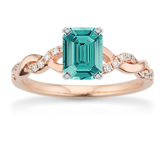 Round Diamond Infinity Engagement Ring in 14k Rose Gold with Emerald Cut Blue-Green Sapphire