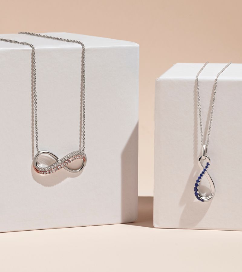 A collection of infinity fashion pendants