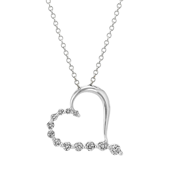 heart necklace with diamonds on one side