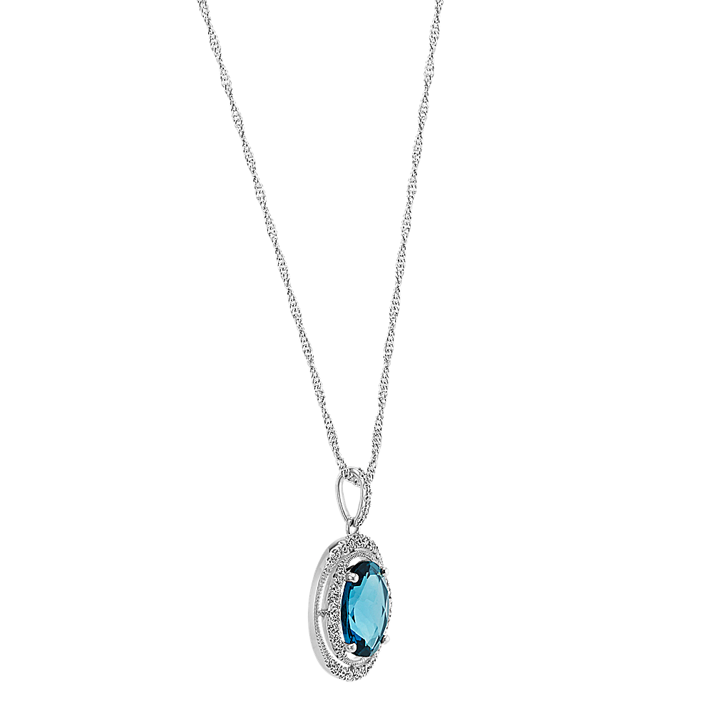 Oval London Blue Topaz and Round Diamond Halo Pendant (18 in) | Shane Co.