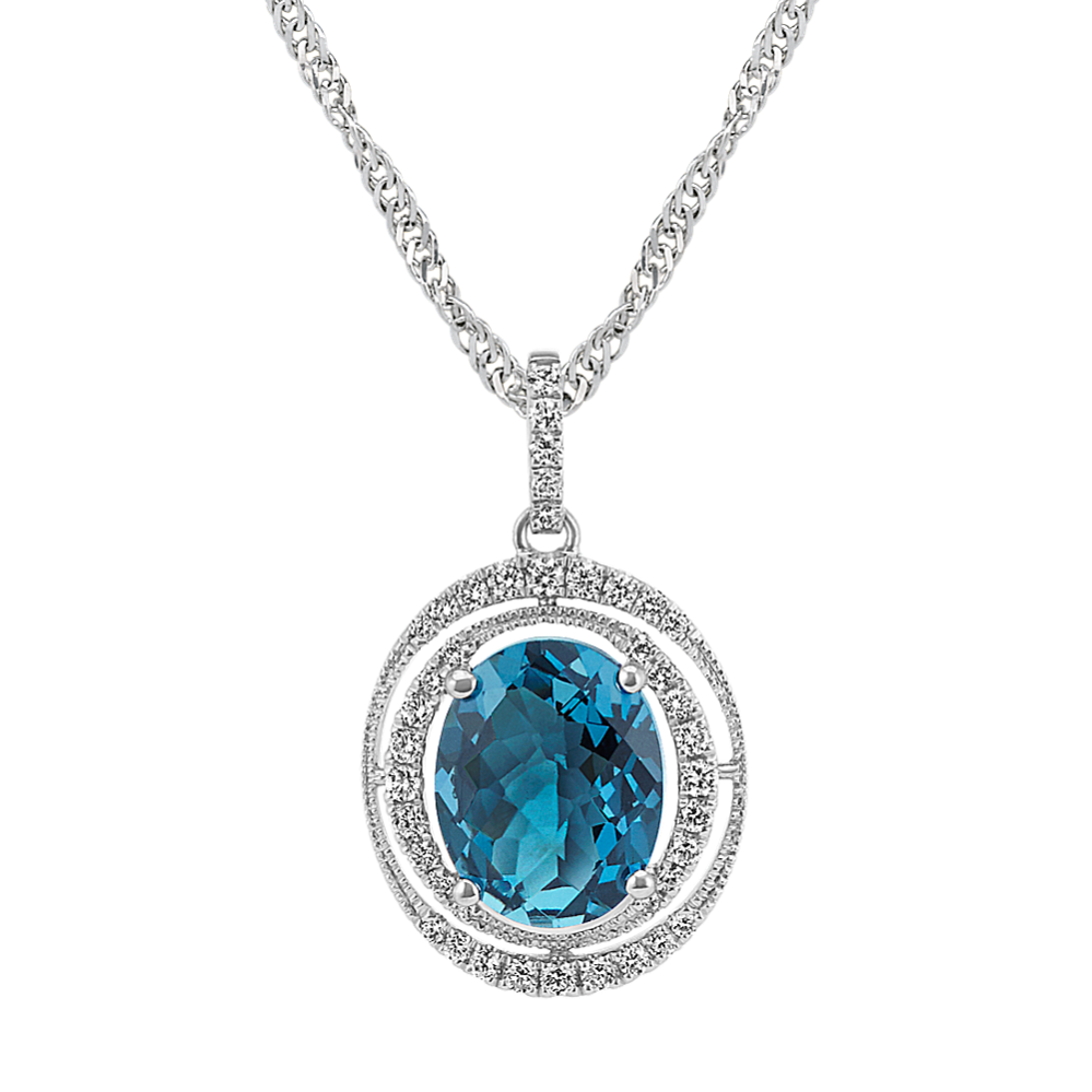 Oval London Blue Topaz and Round Diamond Halo Pendant (18 in)