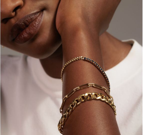 A woman wearing several braclets