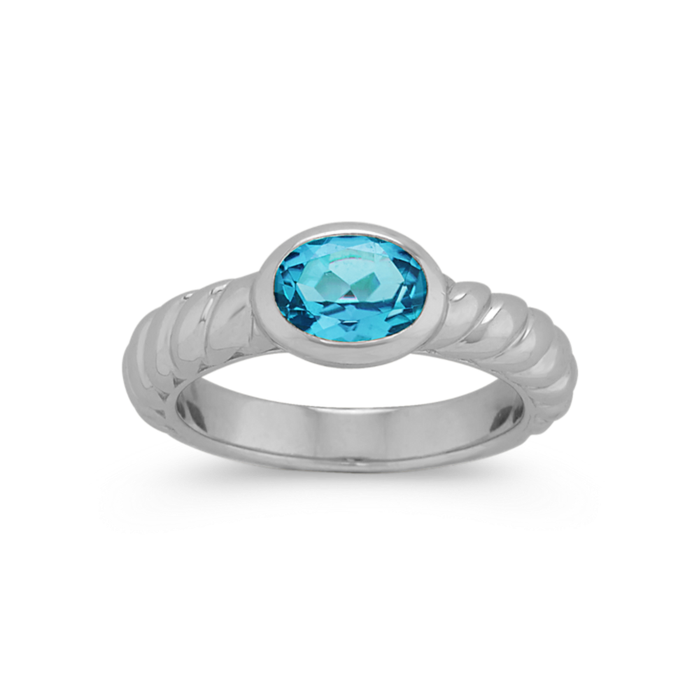 Bezel-Set Oval Sky Blue Topaz Topaz Ring in Sterling Silver