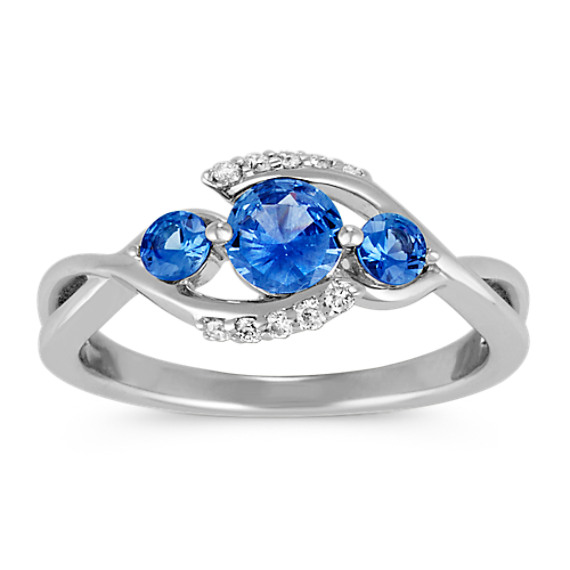 Round Kentucky Blue Sapphire and Diamond Swirl Three-Stone Ring